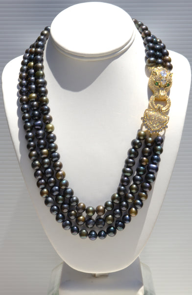 Theodora,  Heftsi Black Fresh water pearls 3 row necklace with gold plated side clasp
