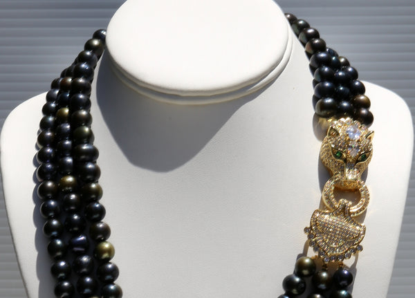 Theodora,  Heftsi Black Fresh water pearls 3 row necklace with gold plated side clasp