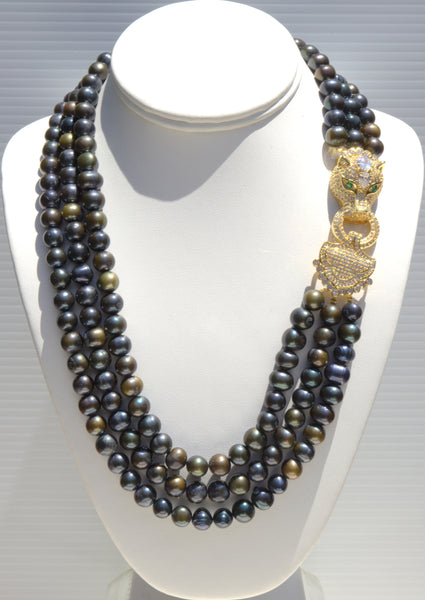 Theodora,  Heftsi Black Fresh water pearls 3 row necklace with gold plated side clasp