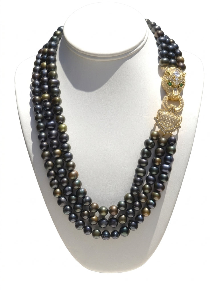 Theodora,  Heftsi Black Fresh water pearls 3 row necklace with gold plated side clasp